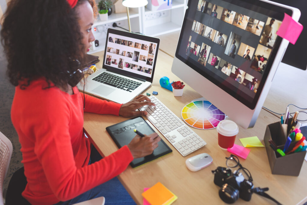 Woman at computer planning and marketing a corporate event