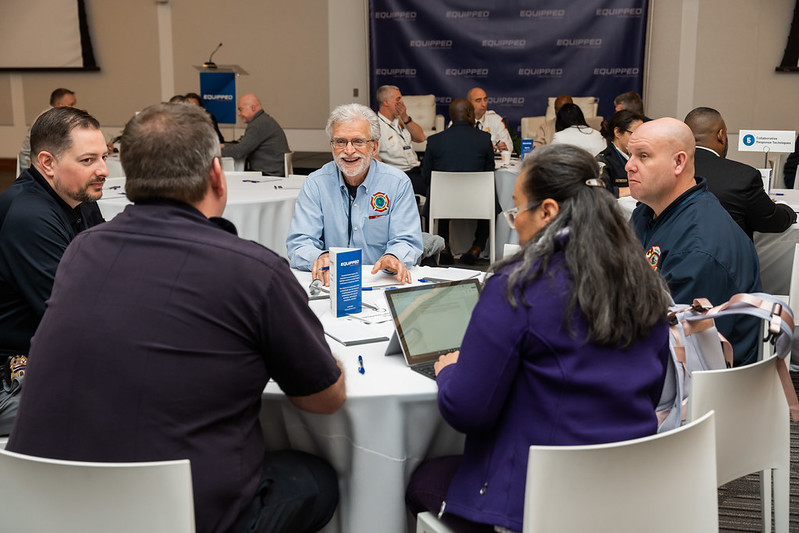Group of people engaging in session topic